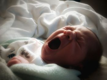 Cute baby sleeping on bed