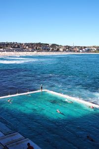 View of swimming pool by sea