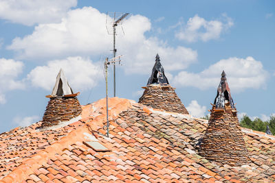 Low angle view of roof of building against sky