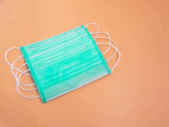 Close-up of blue colored pencils on table against white background