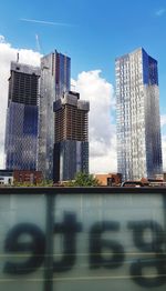 Modern buildings against sky in city