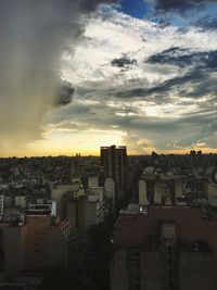 Cityscape against sky during sunset