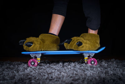 Low section of man playing with toy car