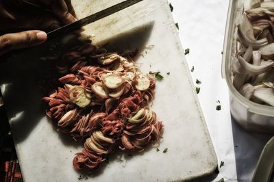 High angle view of person preparing food on table