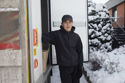 Courier standing near lorry