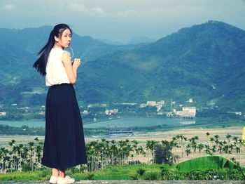 Scenic view of sea with mountains in background