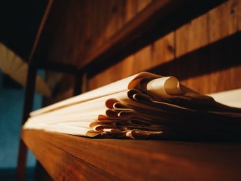 Close-up of papers on shelf