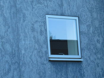 Full frame shot of window on white wall