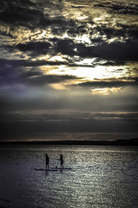 Scenic view of sea against sky at sunset