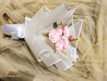 High angle view of pink roses on table