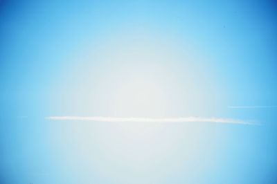 Vapor trail against clear blue sky