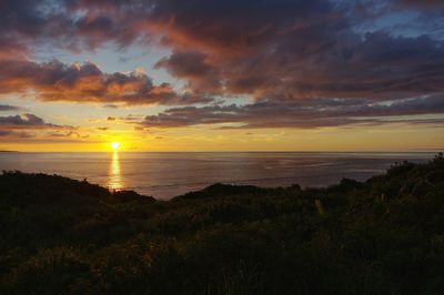 Scenic view of sea against sky during sunset