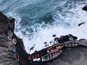 High angle view of beach and fishing boats