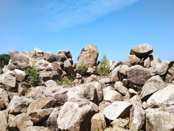 Rock formation against clear blue sky