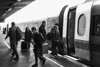 Group of people at railroad station platform