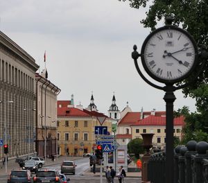 Street amidst buildings in city against sky