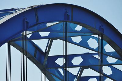 Low angle view of metallic structure against clear blue sky