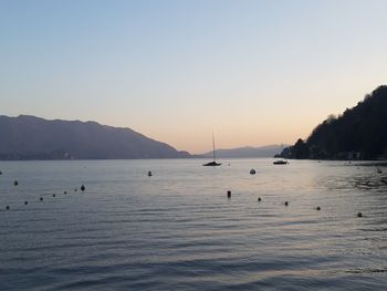 Scenic view of sea against clear sky during sunset