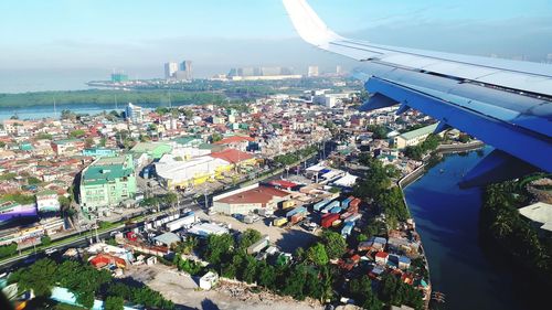 High angle view of city and buildings against sky