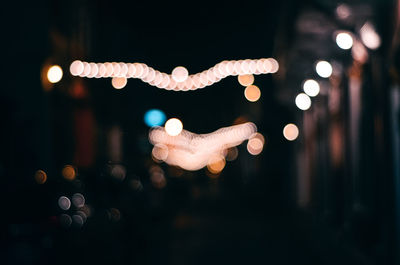 Defocused image of illuminated lights at night