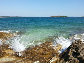 Scenic view of sea against clear sky