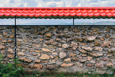 Old style wall made of rough stones with cement. ancient grunge stones wall backdrop. 