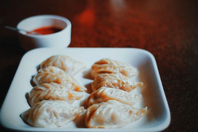 Close-up of dumplings served in plate on table