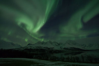 Dramatic sky over snowcapped mountains