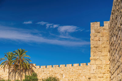 Low angle view of building against blue sky