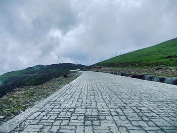 View of landscape against cloudy sky