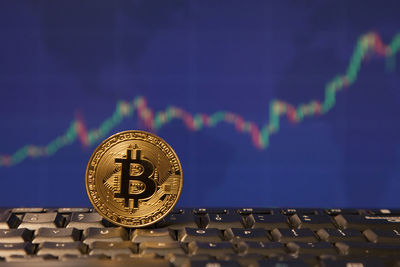 Close-up of coins against black background