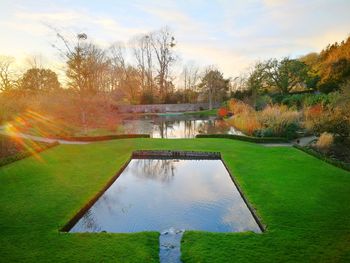 Scenic view of park against sky during autumn