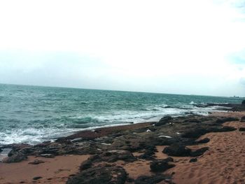 View of calm beach against sky