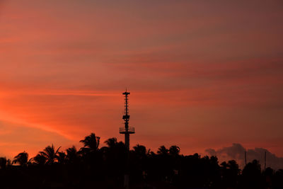 Lighthouse on the beach in the evening