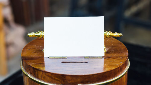 Close-up of paper on table