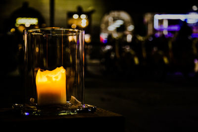 Close-up of tea light candles on table