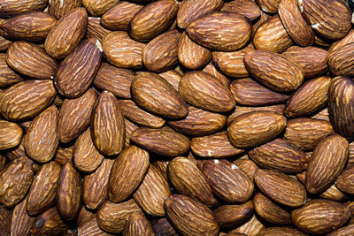 Close up background with almond nuts, macro photo.