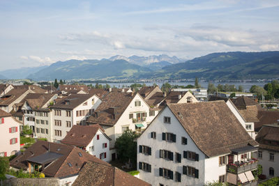 Houses in town against sky