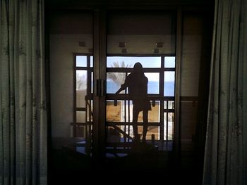 Full length of woman standing in pond