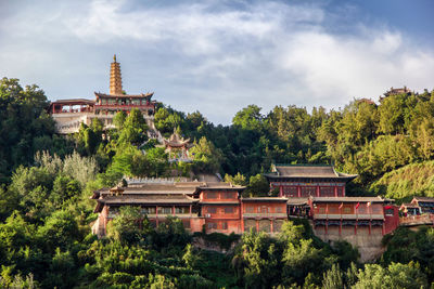 View of temple against building