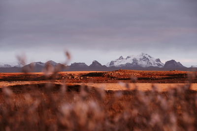 Scenic view of landscape against sky during winter