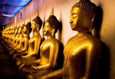 Buddha statue in temple outside building