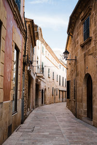 Narrow alley amidst buildings in town