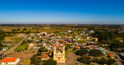 High angle view of townscape against blue sky