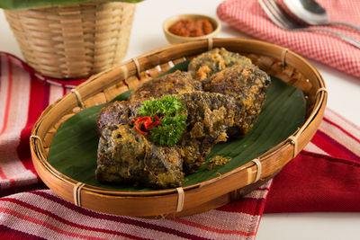 High angle view of food served in basket on table