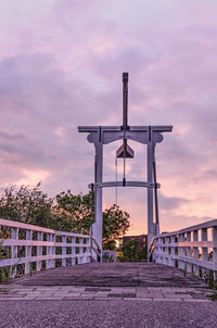 Traditional wooden drawbridge at sunset