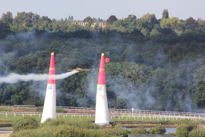 Airplane flying through bollards during race