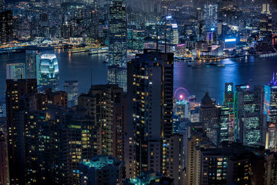 High angle view of city lit up at night