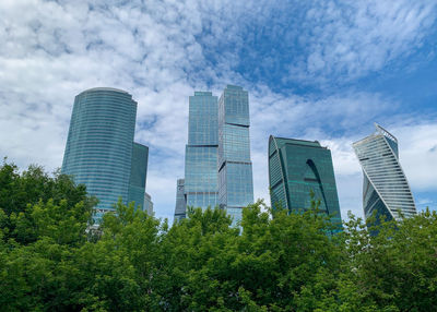 Modern buildings in city against sky