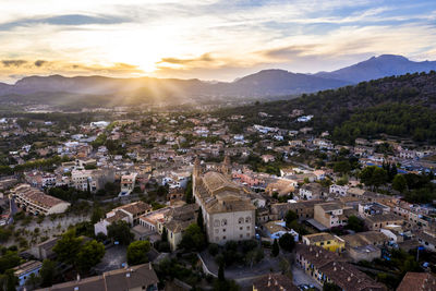 High angle shot of townscape against sky at sunset